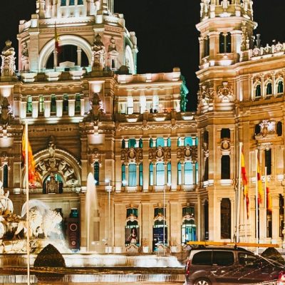 Madrid  Spain

The Plaza de Cibeles is a square with a neo-classical complex of marble sculptures with fountains that has become an iconic symbol for the city of Madrid. It sits at the intersection of Calle de Alcalá (running from east to west), Paseo de Recoletos (to the North) and Paseo del Prado (to the south). Plaza de Cibeles was originally named Plaza de Madrid, but in 1900, the City Council named it Plaza de Castelar, which was eventually replaced by its current name.

It is currently delimited by four prominent buildings: The Bank of Spain, the Palacio de Buenavista, the Palacio de Linares and the Palacio de Cibeles. These constructions are located in four different neighbourhoods from three different adjacent districts: Centro, Retiro and Salamanca.

The building is the the Palace (formerly named Palace of Communication). The cathedral-like landmark was built in 1909 by Antonio Palacios as the headquarters of the postal service. This impressive building was home to the Postal and Telegraphic Museum until 2007 when the landmark building became the Madrid City Hall (Ayuntamiento de Madrid). In the years Cibeles Palace and her fountain have become symbolic monuments of the city (Wikipedia).

Photo details: Exposure 1/6 sec at f/11 (ISO 800), Camera Canon EOS 5D Mark III with a EF17-40mm f/4L USM lens at 33mm. 

Photo by: Iwillbehomesoon. Image license Creative Commons Attribution-NonCommercial-ShareAlike 3.0 Unported (CC BY-NC-SA 3.0).